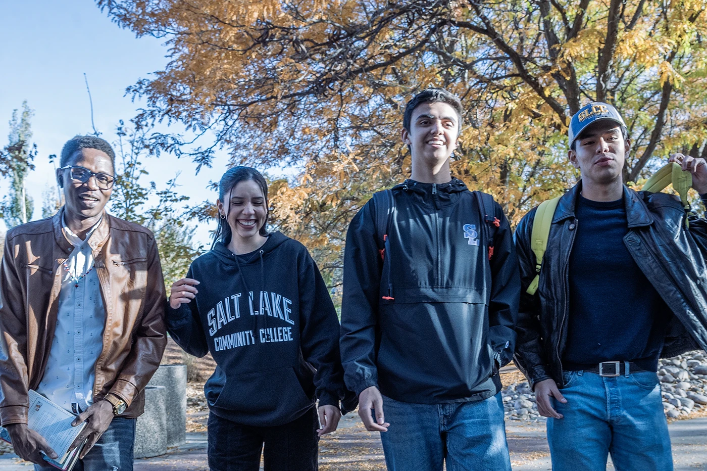 Four students walking on campus