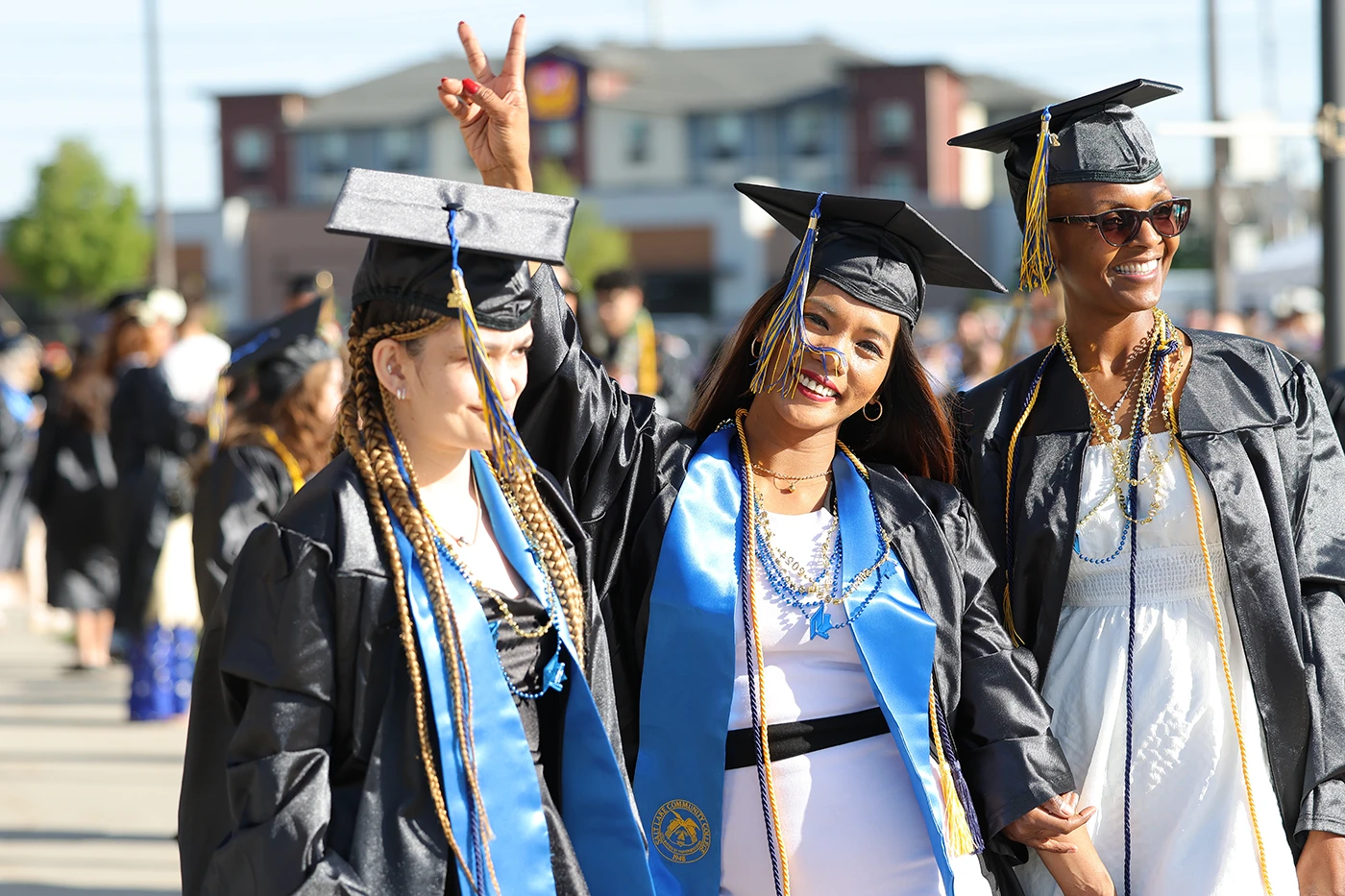 Graduates celebrate outside Maverik Center.