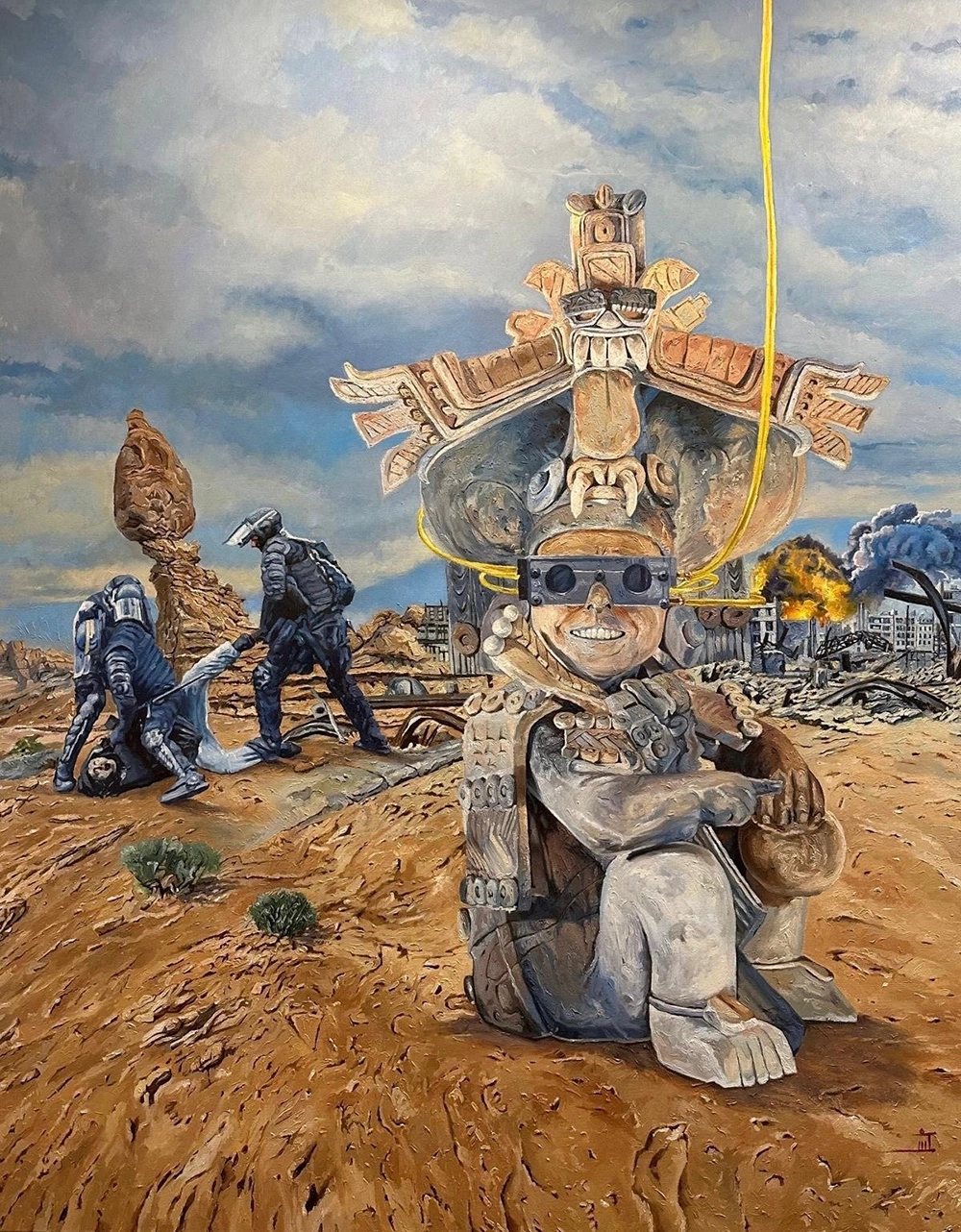 Oil painting. A surrealist tableau of a figure seated in a desert. The figure features the blocky and scrolling shapes of Aztec or Mayan stone sculpture and is wearing a goggle headset connected to a glowing cord that disappears off the top of the canvas. Behind the figure, paramilitary police are beating a man in civilian clothing. The far background depicts a destroyed cityscape, burning and smoking.